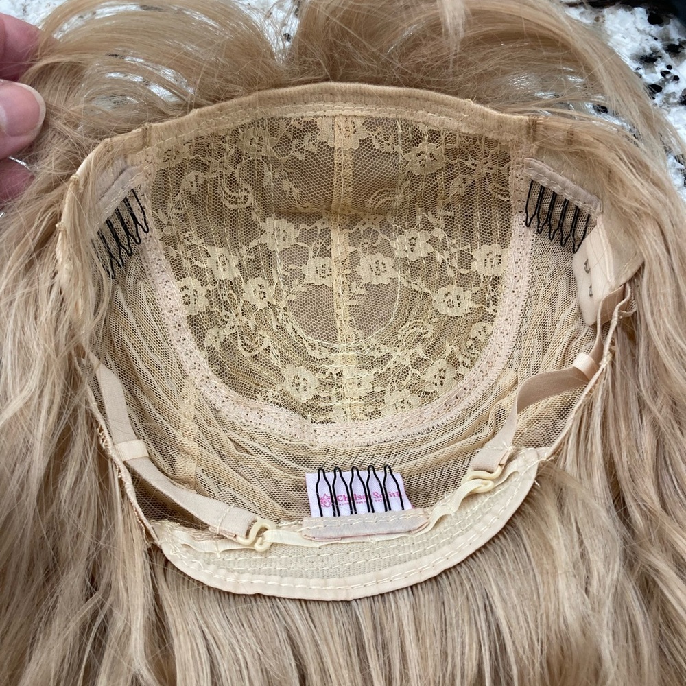 CSC Petunia Wig. The color is like a strawberry blonde.